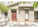 Inviting entryway with a stylish door, manicured garden, and contemporary exterior finishes at 2860 Sunflower Days Ave # 2141, North Las Vegas, NV 89031