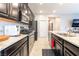 Kitchen features stainless appliances, gas range, granite counters, and ample storage space at 2860 Sunflower Days Ave # 2141, North Las Vegas, NV 89031