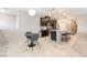 Open kitchen with dark cabinets, stainless appliances, and center island with bar seating at 2860 Sunflower Days Ave # 2141, North Las Vegas, NV 89031