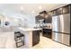 Kitchen boasts stainless steel appliances, granite countertops, and a convenient center island at 2860 Sunflower Days Ave # 2141, North Las Vegas, NV 89031