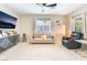 Cozy living room with stylish furnishings, modern decor, and lots of natural light from the windows at 2860 Sunflower Days Ave # 2141, North Las Vegas, NV 89031
