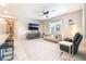 Open living space with carpet floors, modern furniture, and easy access to the kitchen area at 2860 Sunflower Days Ave # 2141, North Las Vegas, NV 89031