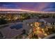 A neighborhood rooftop view features a home with solar panels, desert landscaping, and a stunning cityscape backdrop at 2862 Athens Ridge Dr, Henderson, NV 89052