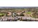 An aerial view of a community with a lush golf course and well-maintained homes at 2862 Athens Ridge Dr, Henderson, NV 89052