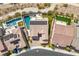 Stunning aerial view showcasing a home with a pool, spa, solar panels and a putting green at 2862 Athens Ridge Dr, Henderson, NV 89052