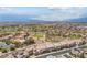 Beautiful aerial view overlooking a community featuring golf course and mountain views at 2862 Athens Ridge Dr, Henderson, NV 89052
