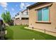 Backyard view with a lush putting green and well-maintained landscaping at 2862 Athens Ridge Dr, Henderson, NV 89052