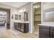 Stylish bathroom featuring a dual sink vanity, wood floors, and a walk-in closet at 2862 Athens Ridge Dr, Henderson, NV 89052