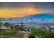 Expansive city view featuring the Las Vegas skyline, mountains, and lush landscaping at 2862 Athens Ridge Dr, Henderson, NV 89052