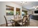 Bright dining area with large windows and an elegant dining table that comfortably seats six guests at 2862 Athens Ridge Dr, Henderson, NV 89052