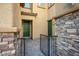 Welcoming front entry featuring stone accents and a secure gated courtyard at 2862 Athens Ridge Dr, Henderson, NV 89052