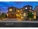Stunning two-story home with attached two car garage featuring stone accents and beautiful desert landscaping at 2862 Athens Ridge Dr, Henderson, NV 89052