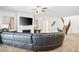 Bright, open living space with a modern fireplace, spacious seating and staircase to upper level at 2862 Athens Ridge Dr, Henderson, NV 89052