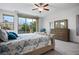 Inviting main bedroom with large windows, a decorative ceiling fan, and stylish furniture at 2862 Athens Ridge Dr, Henderson, NV 89052