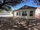Backyard view featuring home and pool at 316 Lingering Ln, Henderson, NV 89012