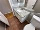 Powder room with granite countertop and red tile floors at 316 Lingering Ln, Henderson, NV 89012