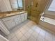 Modern bathroom featuring double sink vanity, separate shower, and soaking tub at 316 Lingering Ln, Henderson, NV 89012