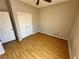 This bedroom features wood-look floors and a spacious closet at 316 Lingering Ln, Henderson, NV 89012