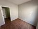 Neutral bedroom with terracotta tile flooring, and direct access to the adjacent hallway at 316 Lingering Ln, Henderson, NV 89012