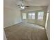 Large bedroom featuring a ceiling fan and multiple windows for natural light at 316 Lingering Ln, Henderson, NV 89012