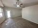 Large bedroom featuring a ceiling fan and multiple windows for natural light at 316 Lingering Ln, Henderson, NV 89012