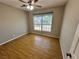 Bedroom with ceiling fan and large window showing the front yard at 316 Lingering Ln, Henderson, NV 89012