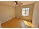 Bedroom featuring a ceiling fan, wood flooring and a window at 316 Lingering Ln, Henderson, NV 89012