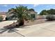 Charming single-story home featuring desert landscaping, a two-car garage and concrete driveway at 316 Lingering Ln, Henderson, NV 89012