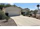 Attractive single-story home with a two-car garage and an extended driveway nestled in a desert landscape at 316 Lingering Ln, Henderson, NV 89012