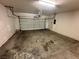 A dirty and disorganized two car garage at 316 Lingering Ln, Henderson, NV 89012