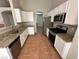 Well-lit kitchen features stainless steel appliances, granite countertops, and ample cabinet space at 316 Lingering Ln, Henderson, NV 89012