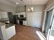 Modern kitchen with white cabinets, stainless steel appliances, and tile flooring at 316 Lingering Ln, Henderson, NV 89012