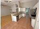 Modern kitchen features granite countertops, stainless steel appliances, and tiled flooring at 316 Lingering Ln, Henderson, NV 89012