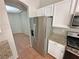 Kitchen with stainless appliances and granite counters, plus an adjoining dining space at 316 Lingering Ln, Henderson, NV 89012