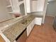 Spacious kitchen with granite countertops, stainless steel dishwasher and ample counter space at 316 Lingering Ln, Henderson, NV 89012