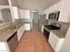 Well-lit kitchen features granite counters, stainless appliances, and neutral cabinetry at 316 Lingering Ln, Henderson, NV 89012