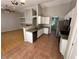 Open-concept kitchen featuring granite countertops, stainless steel appliances, and terracotta tile flooring at 316 Lingering Ln, Henderson, NV 89012