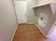 Functional laundry room with tile flooring and hookups for washer and dryer at 316 Lingering Ln, Henderson, NV 89012