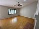 Cozy living room with hardwood floors, a ceiling fan, and large windows at 316 Lingering Ln, Henderson, NV 89012