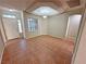 Open living room featuring high ceilings, natural lighting, and tiled floors at 316 Lingering Ln, Henderson, NV 89012