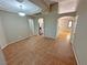Open living room with tiled floor, high ceilings, neutral paint, and multiple arched doorways at 316 Lingering Ln, Henderson, NV 89012