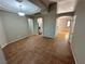 View of the spacious living room with archways leading to the kitchen and other areas at 316 Lingering Ln, Henderson, NV 89012