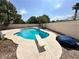 Backyard pool with diving board and concrete surround, perfect for summer fun at 316 Lingering Ln, Henderson, NV 89012