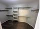 Walk-in closet with a carpeted floor and shelves and rods for storage at 316 Lingering Ln, Henderson, NV 89012