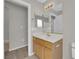 A bathroom featuring an elegant vanity and mirrored wall cabinets enhances the modern feel at 3228 Jumping Hills Ave, Henderson, NV 89052