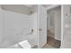 Clean bathroom with a bathtub and shower, showcasing a bright and functional space at 3228 Jumping Hills Ave, Henderson, NV 89052