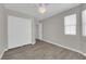 Bright bedroom featuring wood floors, neutral paint, ceiling fan, and closet space at 3228 Jumping Hills Ave, Henderson, NV 89052
