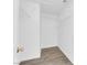 A walk-in closet with white walls, wire shelving, and wood-look floors at 3228 Jumping Hills Ave, Henderson, NV 89052