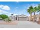 Charming single-story home with desert landscaping, palm trees, and a two-car garage at 3228 Jumping Hills Ave, Henderson, NV 89052