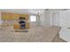 An open kitchen design with stainless steel appliances and light brown cabinetry is the focal point at 3228 Jumping Hills Ave, Henderson, NV 89052